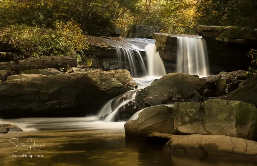 Cascade of waterfall into swimming hole with blurred motion on Deckers Creek running by Route 7 near Masontown in Preston County West Virginia