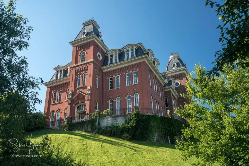 The historic Woodburn Hall at West Virginia University or WVU in Morgantown WV seen from below and looking up towards the rear and side of the building.