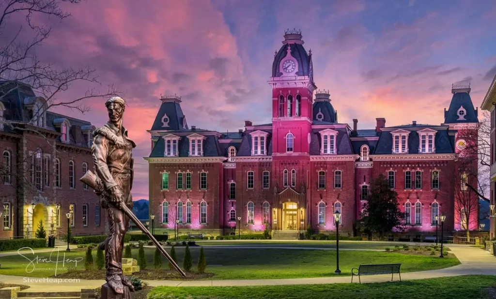 Dramatic image of Woodburn Hall at West Virginia University or WVU in Morgantown WV with the famous Mountaineer statue composited into the photo. Perfect for a graduation gift for a student or for the wall of a faculty office