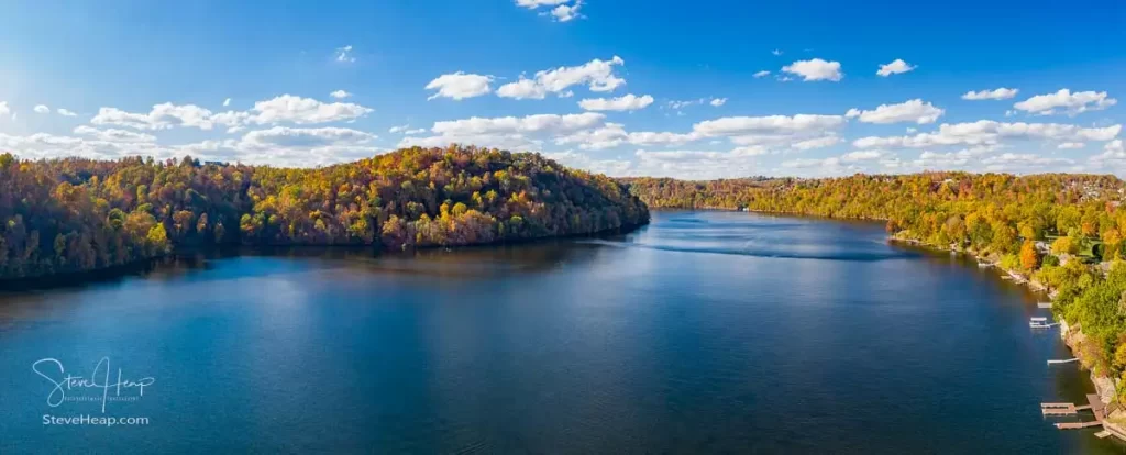 Aerial drone panorama of the autumn fall colors surrounding Cheat Lake over the interstate I68 bridge near Morgantown West Virginia