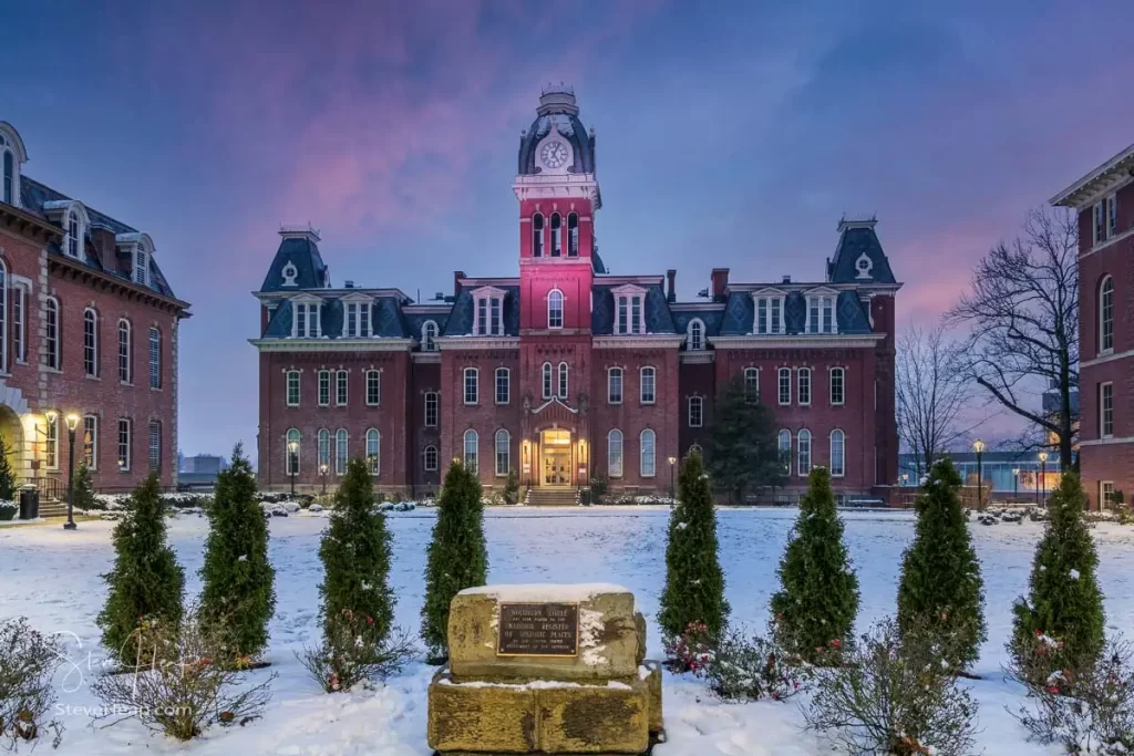Dramatic image of Woodburn Hall at West Virginia University or WVU in Morgantown WV after a snow fall around the historic building.