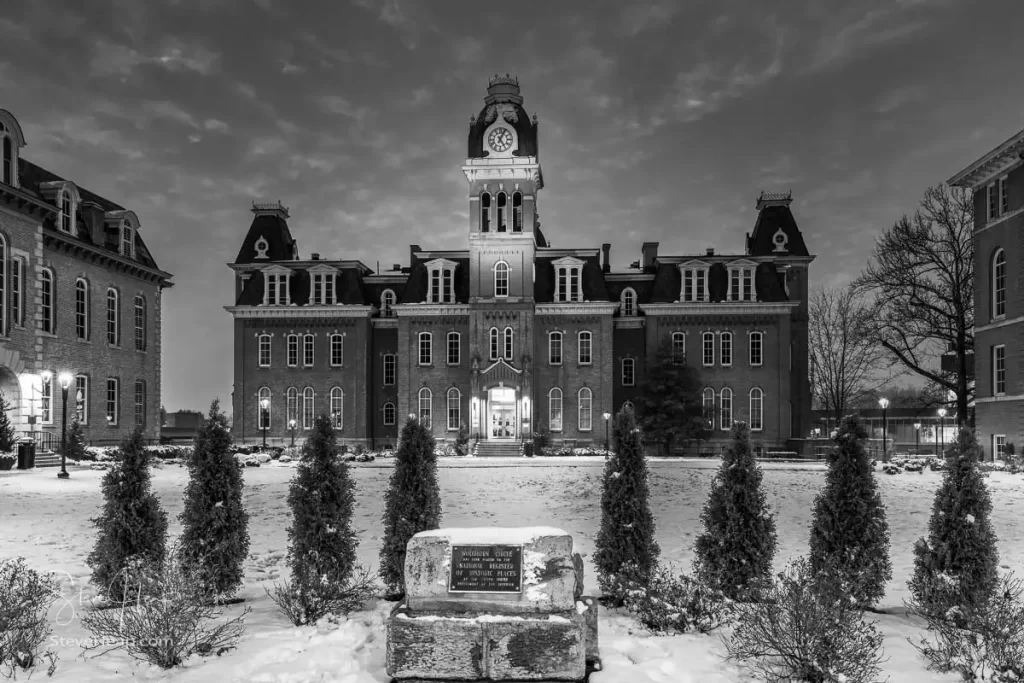 Dramatic monochrome image of Woodburn Hall at West Virginia University or WVU in Morgantown WV after a snow fall around the historic building. Perfect for a graduation gift for your student or to grace the wall of a faculty office!