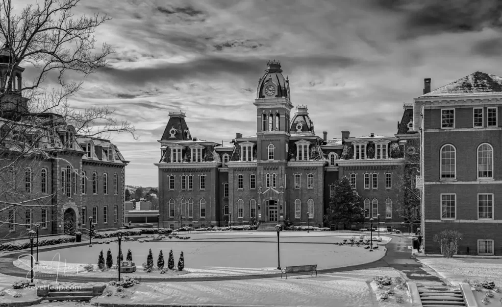 Dramatic black and white retro image of Woodburn Hall at West Virginia University or WVU in Morgantown WV after a snow fall around the historic building. This historic building is a University icon for WVU. Perfect for a graduation gift for your student or to grace the wall of a faculty office!