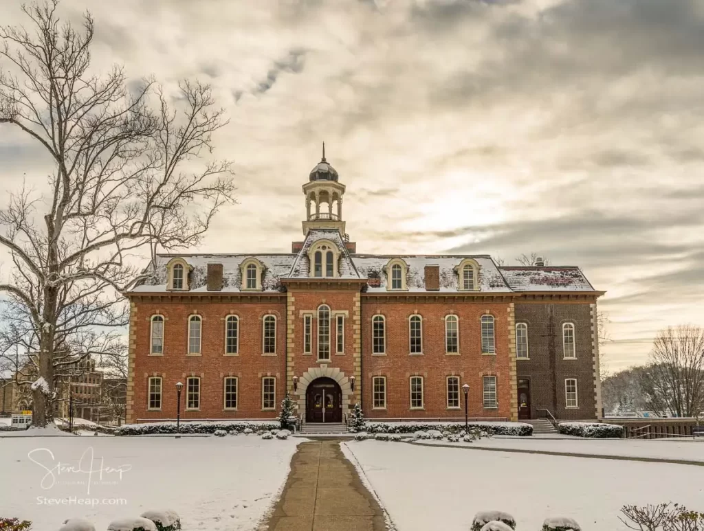 Dramatic image of Martin Hall at West Virginia University or WVU in Morgantown WV after a snow fall around the historic building.