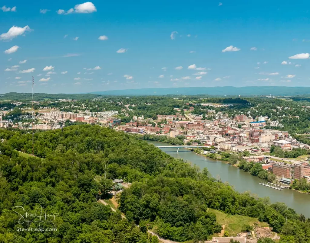 Aerial drone panoramic shot of the downtown area of Morgantown with the WVU campus in the fall