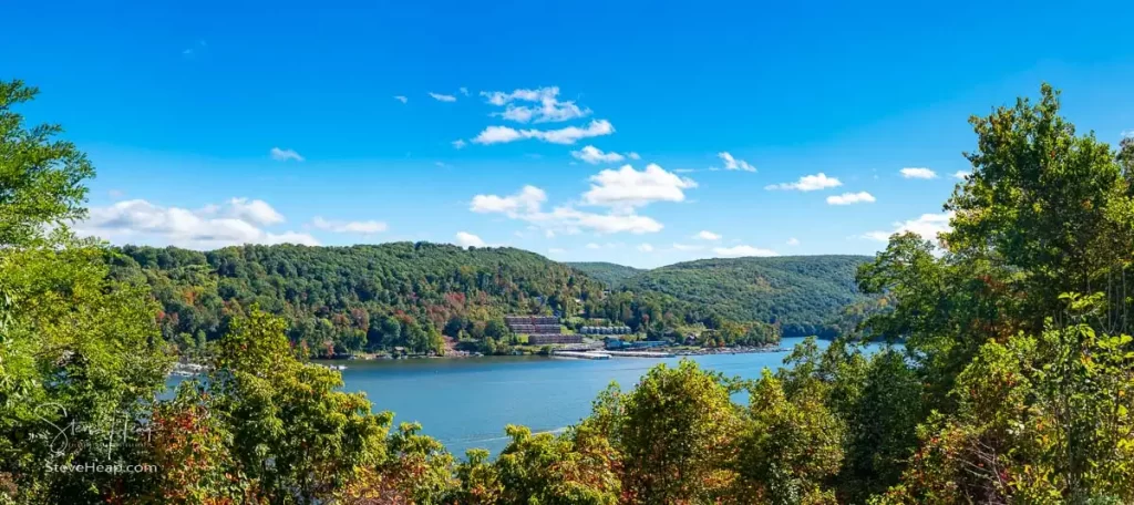 Panorama of the early autumn fall colors surrounding Cheat Lake from the waterside near Morgantown, West Virginia