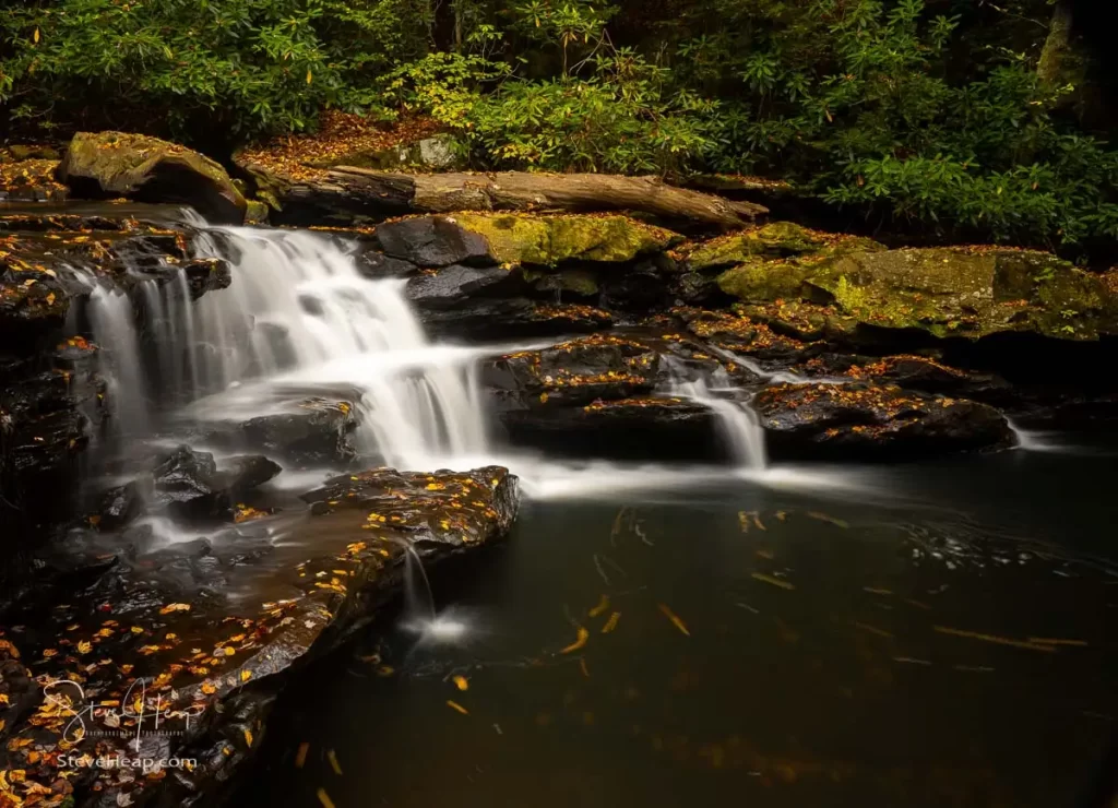 Cascade of waterfall into swimming hole with blurred motion on Deckers Creek running by Route 7 near Masontown in Preston County West Virginia