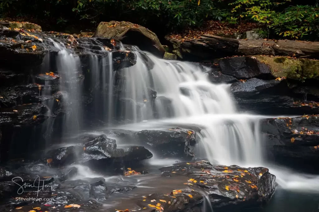 Cascade of waterfall into swimming hole with blurred motion on Deckers Creek running by Route 7 near Masontown in Preston County West Virginia