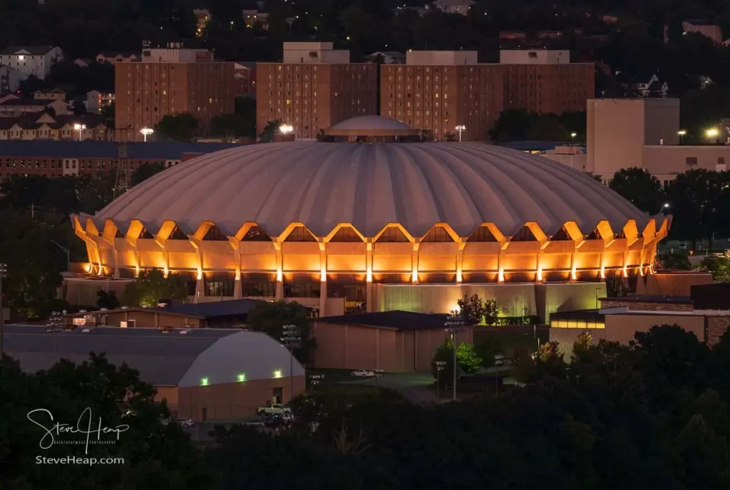 Illuminated Coliseum in the foreground on the Evansdale Campus of WVU just after sunset