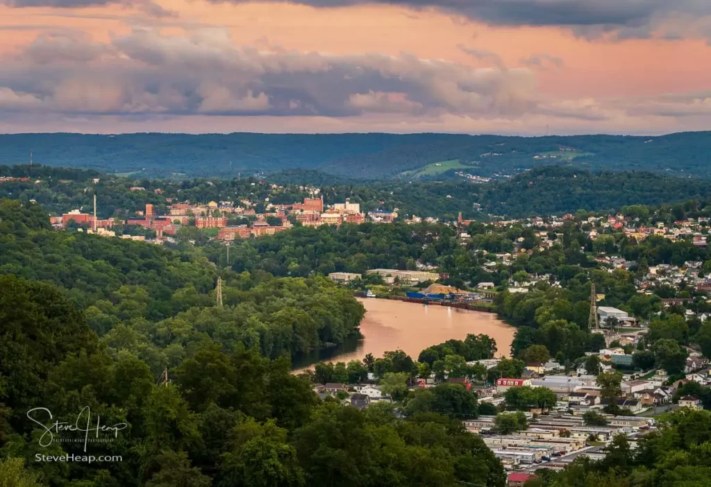 Cityscape of the cities of Granville and Morgantown in West Virginia at dusk with interesting sunset lighting the sky and reflecting in the river