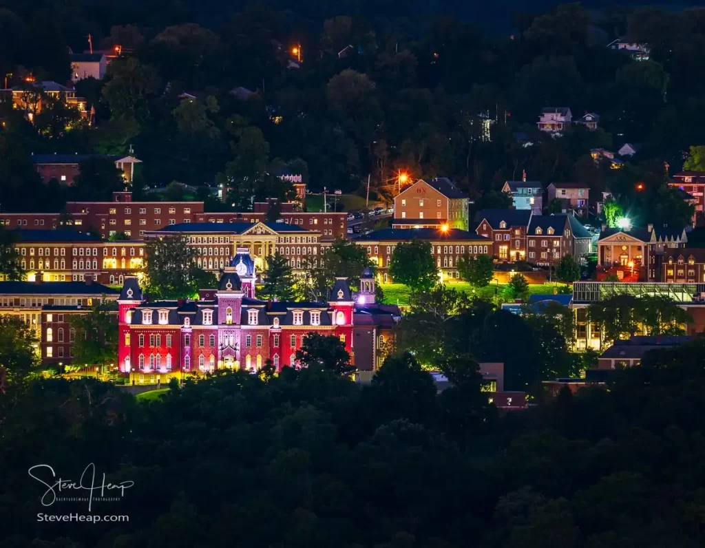 Downtown campus of West Virginia university and Woodburn hall as dusk and lights give a warm glow to Morgantown WV.