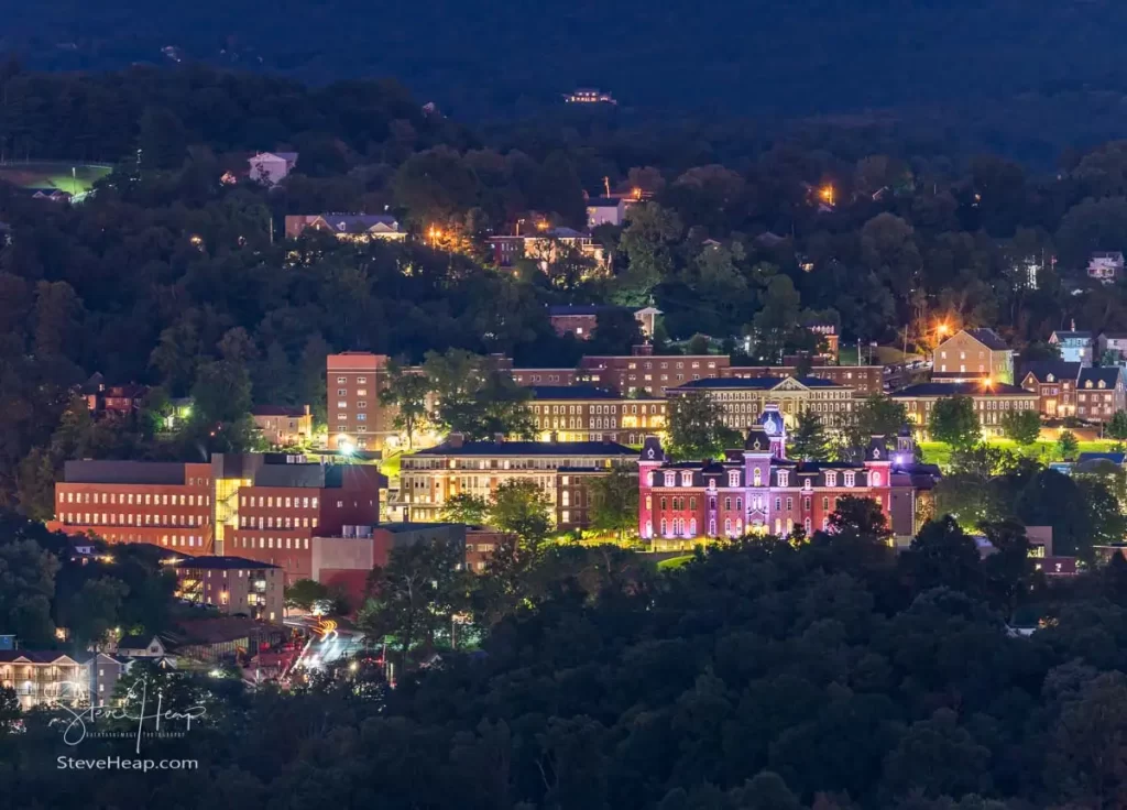 Downtown campus of West Virginia university and Woodburn hall as dusk and lights give a warm glow to Morgantown WV