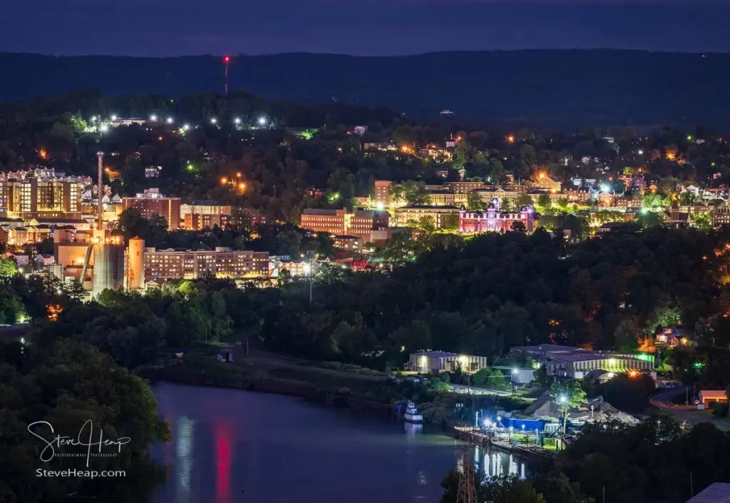 Downtown campus of West Virginia university and Woodburn hall as dusk and lights give a warm glow to Morgantown WV