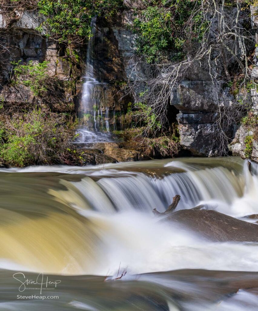 Small waterfall cascade on rocks by Valley Falls State Park near Fairmont in West Virginia on a colorful and bright spring day