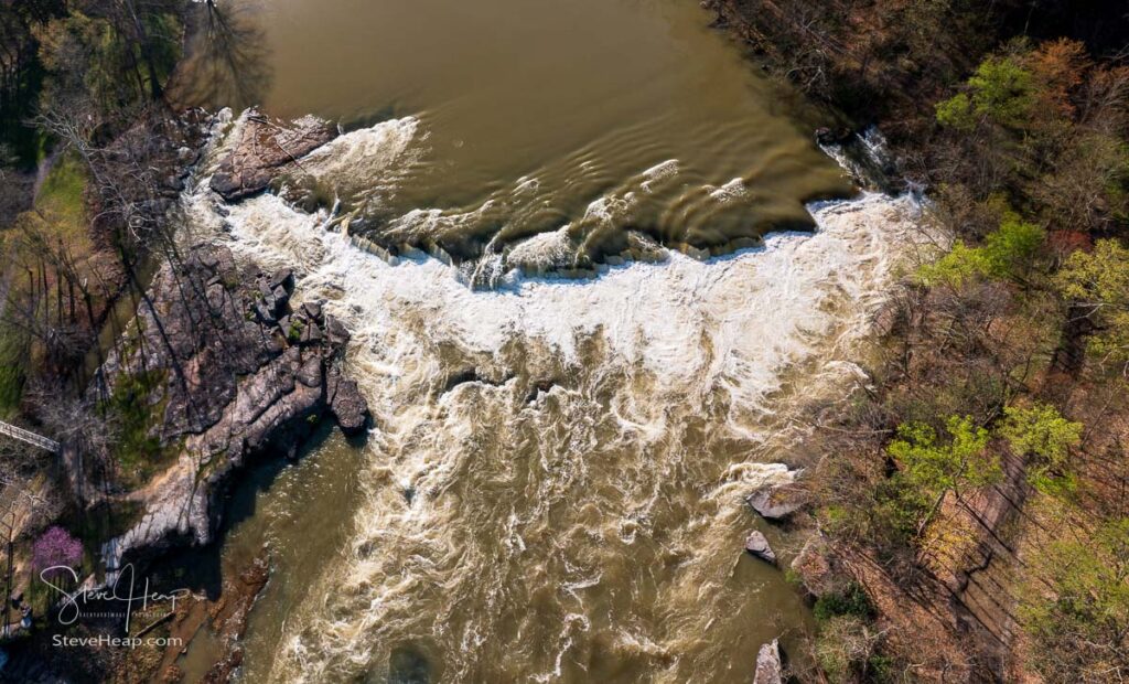 Aerial vertical view of Valley Falls State Park near Fairmont in West Virginia on a spring day with redbud blossoms