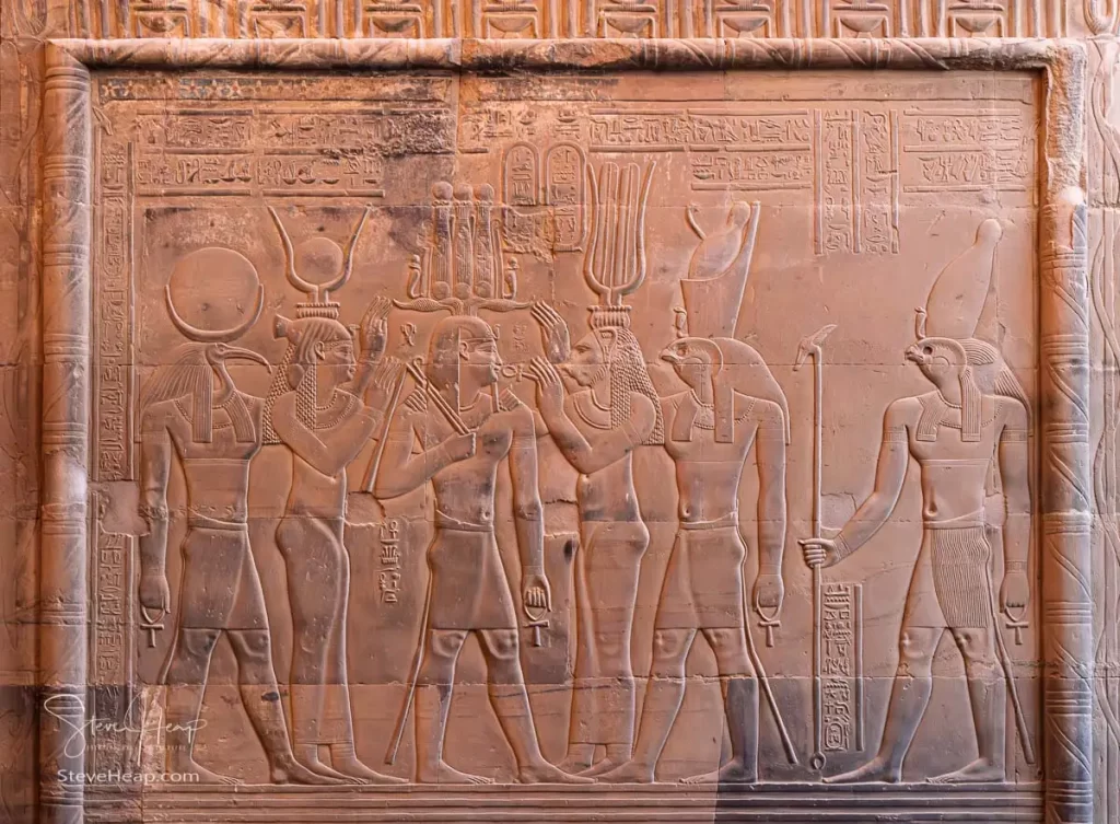Detailed carving of the gods and goddesses around the Pharoah