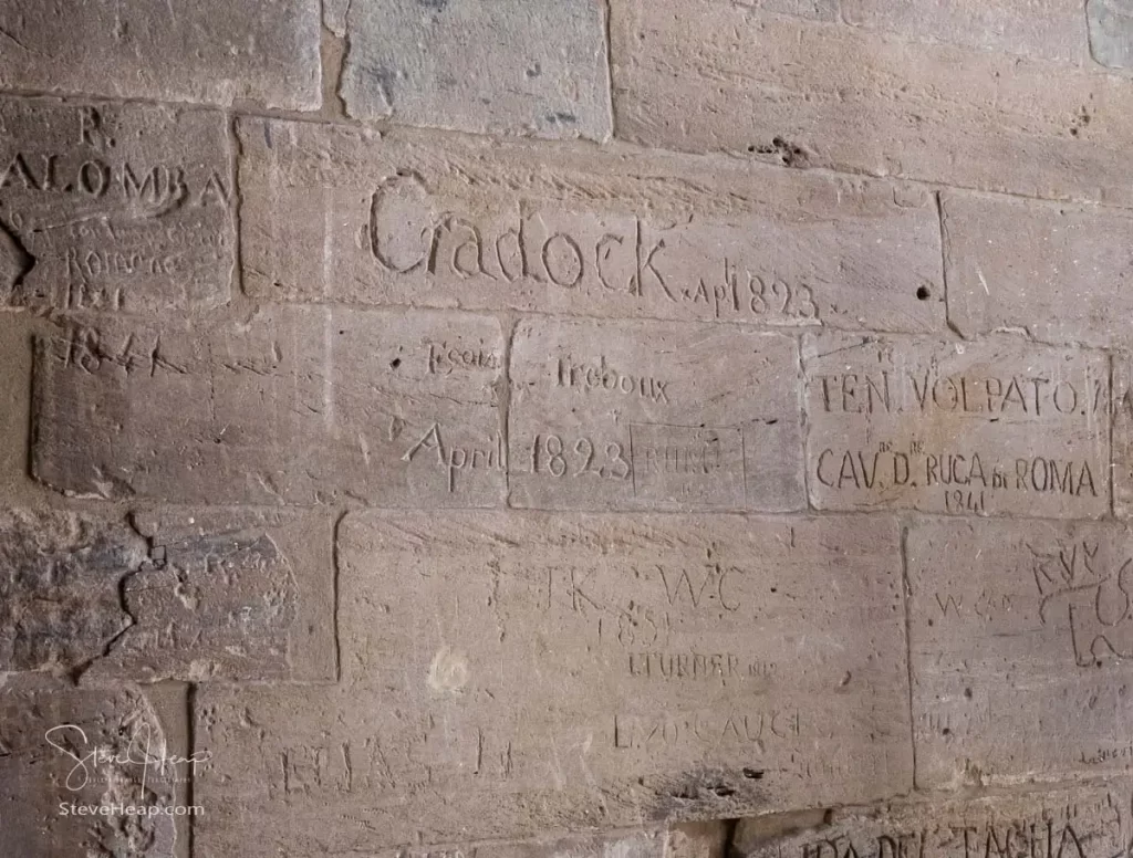Names of visitors from the 1800s scratched and carved into the walls of the temple
