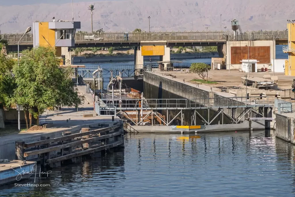 The preceding cruise boat sinking lower in the Esna lock as it continues its journey north on the Nile
