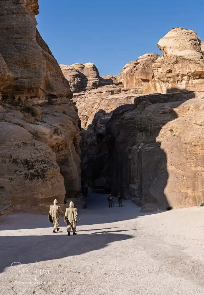 Soldiers entering the narrow gorge of the Siq entering Petra