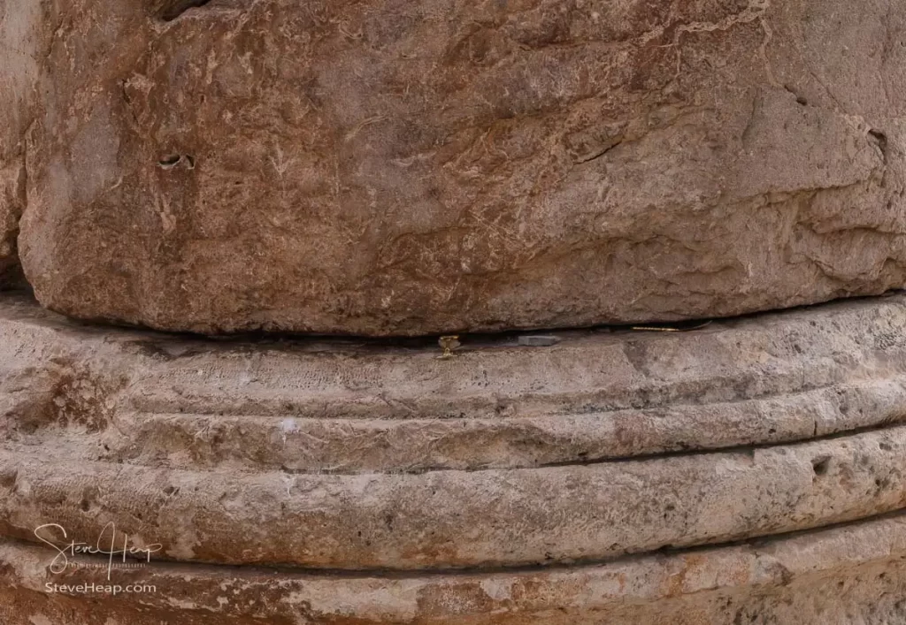 Small items inserted under the column that amplify the movement of the column as it gently rocks