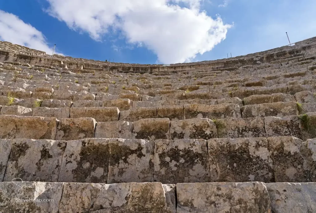 Steep vertiginous steps form the seating in the South Theatre of the roman city of Jerash in Jordan