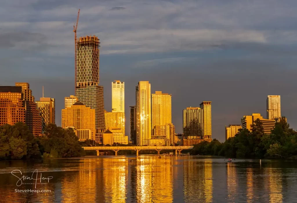 The golden light of the sun illuminates Lady Bird Lake and the Austin skyline. Prints available in my online store