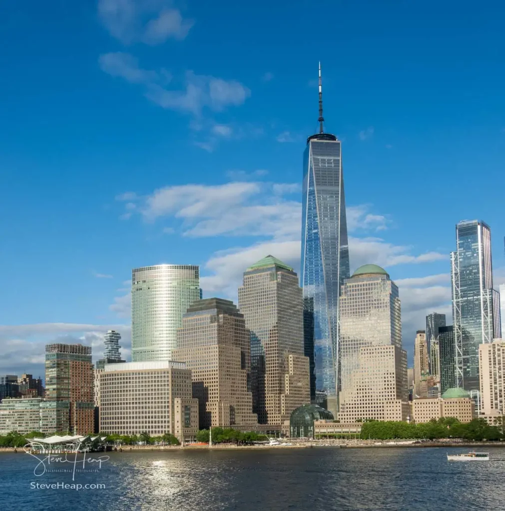 Tall office buildings and One World Trade Center along the waterfront in Lower Manhattan as seen from Hudson River