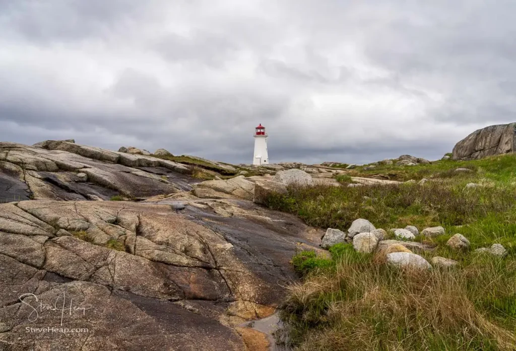 The lighthouse at Peggy's Cove seen from the rocky headland