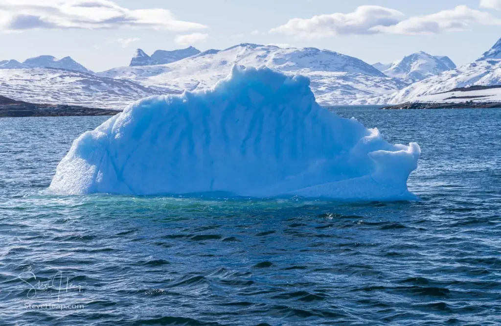 Iceberg floating down the fjord towards Nuuk