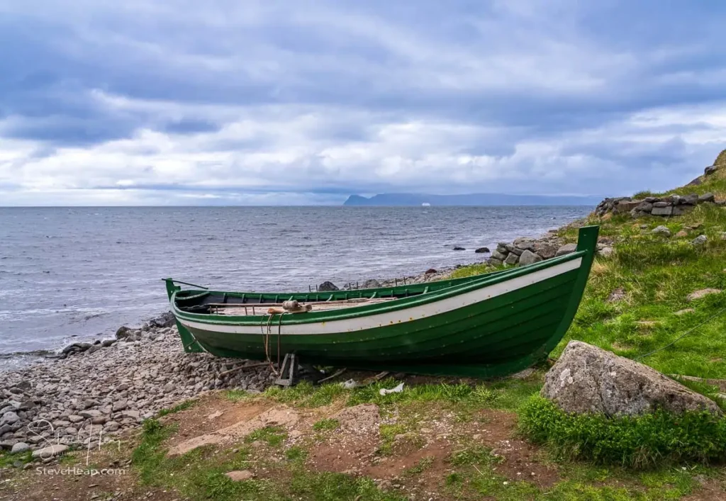 Fishing boat on shore in Bolungarvik village near Isafjordur in Iceland