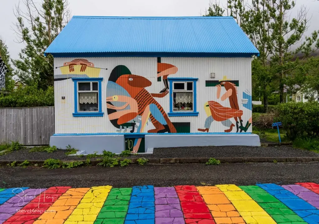 Wall mural on home on the famous Rainbow street with mist covering the hills