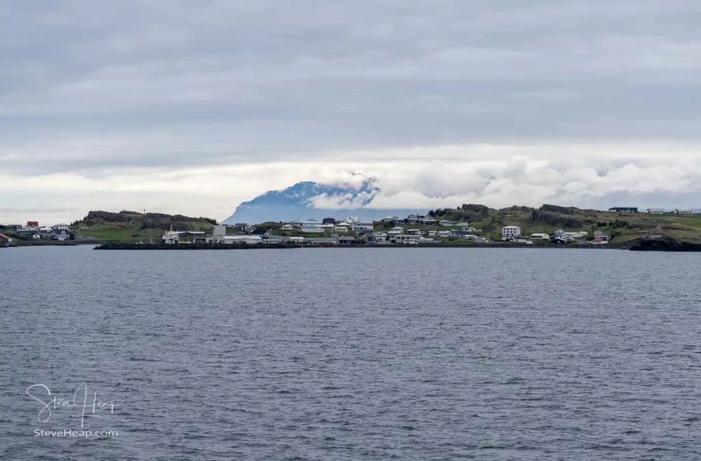 Panorama of the small town of Djupivogur in Eastern Iceland on a cold cloudy day seen from departing cruise ship