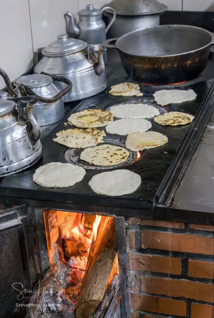 Cooking our somewhat misshapen tortillas