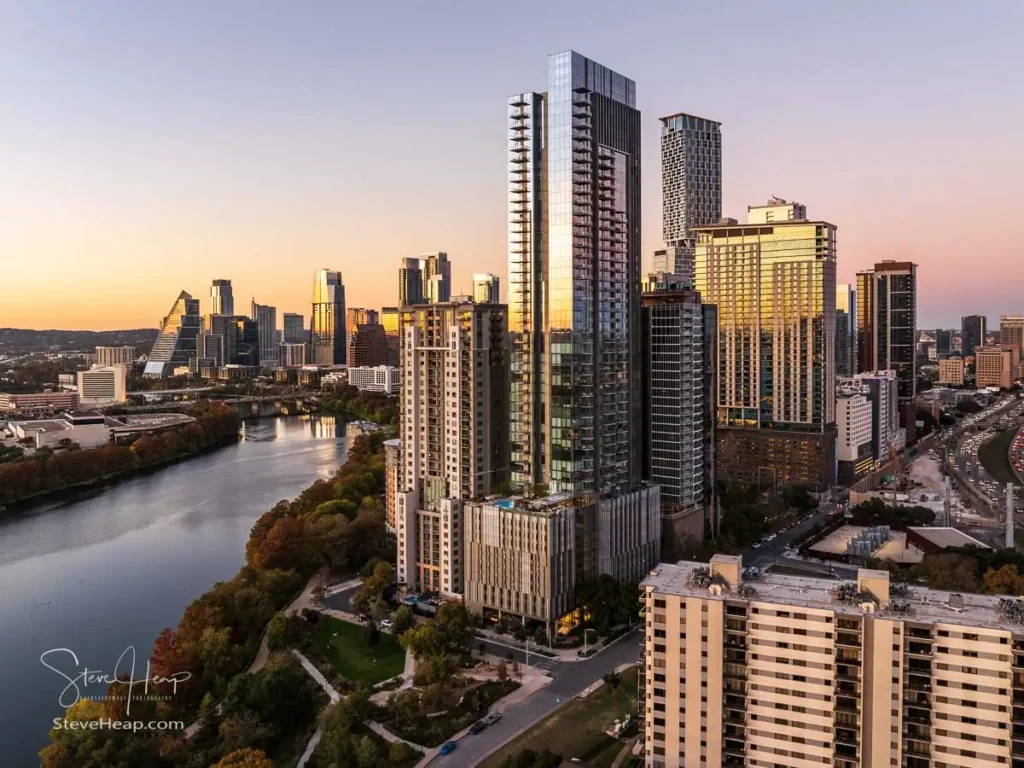 A close-up aerial view of the 44 East Tower in the Rainey Street District of Austin during early evening. The sharp architectural lines of the modern glass building make it a perfect subject for an industrial metal print.