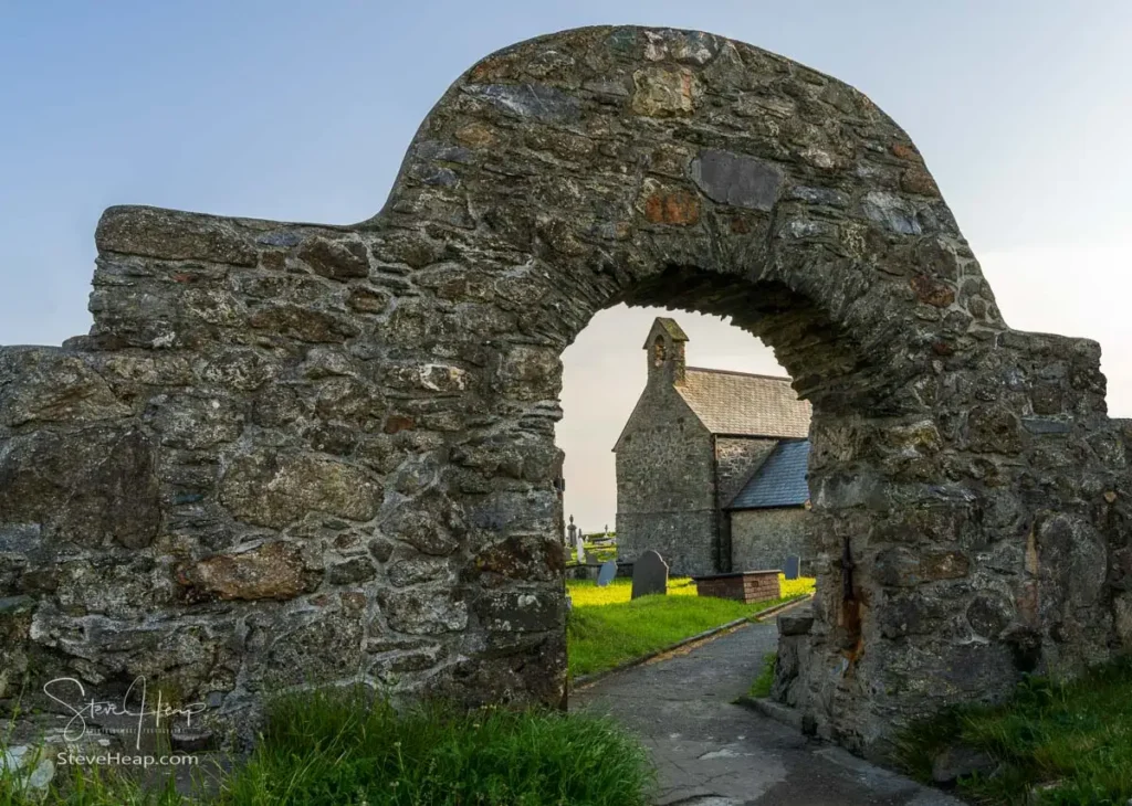Ancient stone archway framing Eglwys Llanbadrig church on the Anglesey headland
