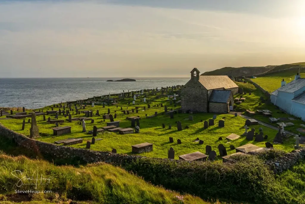 Eglwys Llanbadrig church perched on the grassy coastal cliffs of North Wales